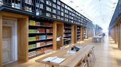 Aisle in a library with bookcases on both sides